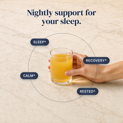 [en] Hand holding a glass of the golden Z22 night drink with callouts: sleep, calm, recovery, rested. Nightly support for your sleep.